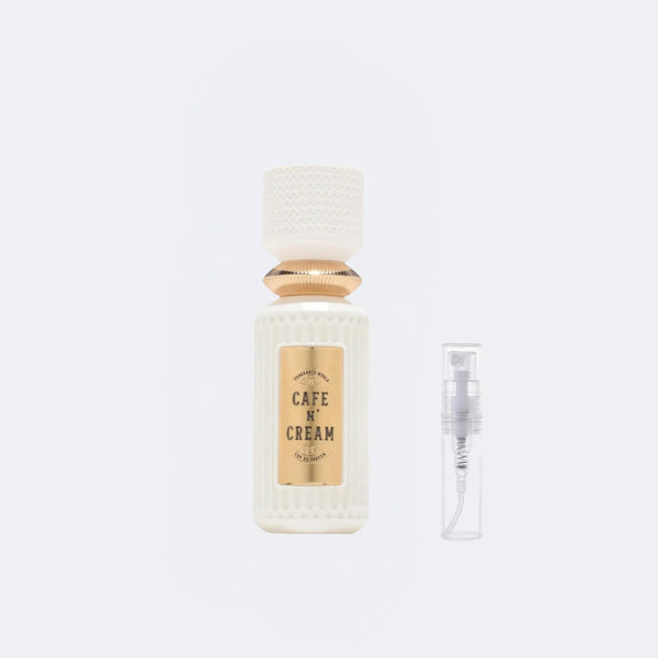 Perfume bottle labeled 'Cafe N Cream' on a white background