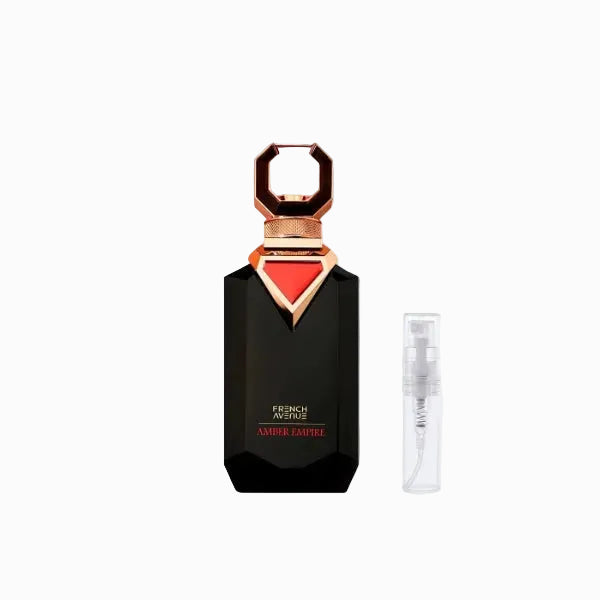 Black perfume bottle with red cap and gold accents on a white background