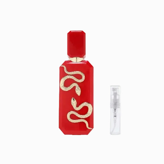 Red perfume bottle with gold snake design on a white background